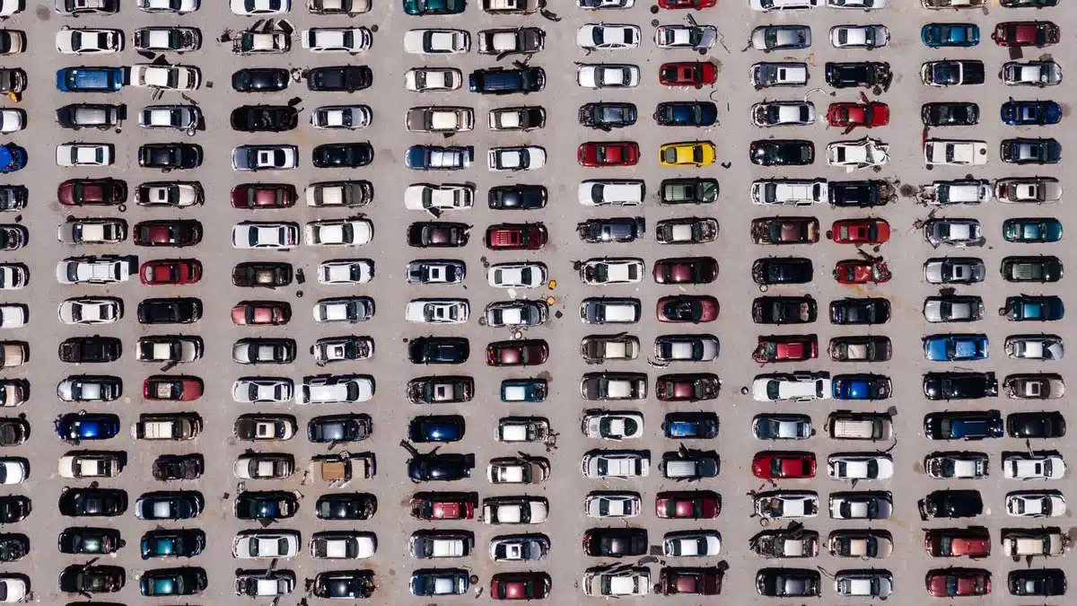 Aerial view of rows of vehicles in an auction storage lot