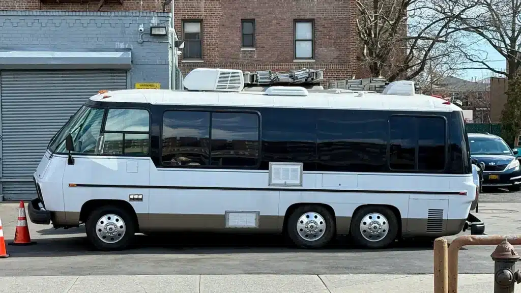 Class A GMC motorhome parked and ready for transport