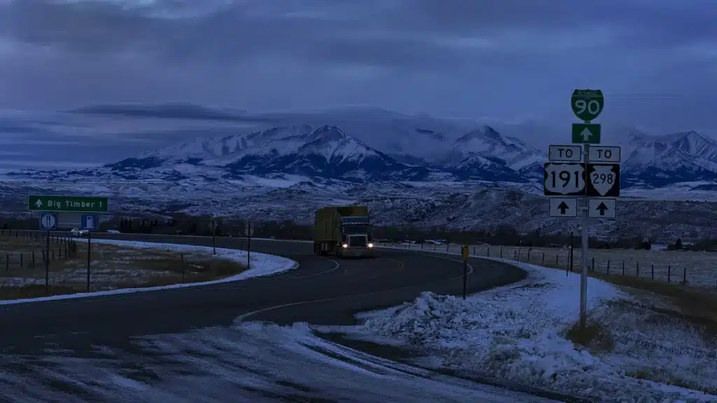 Long-haul truck on a mountain highway in winter
