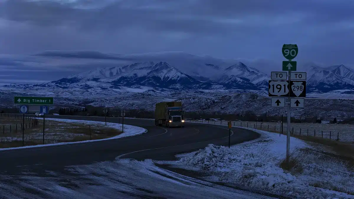 Long-haul truck on a mountain highway in winter