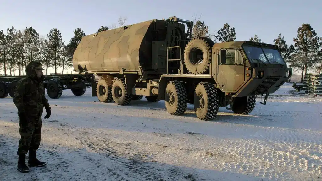 Heavy military transport vehicle staged in winter conditions